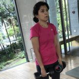 Female personal training program in Singapore gym.